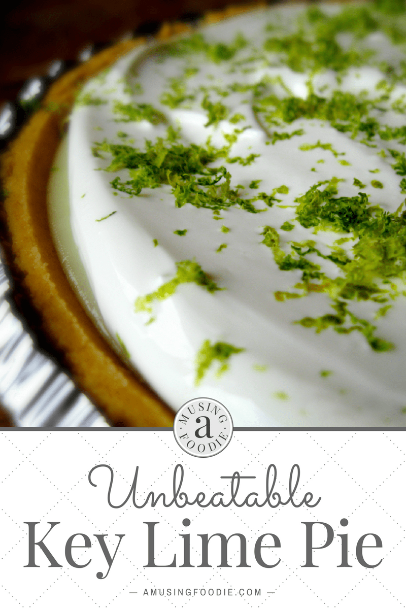 Close up shot of homemade key lime pie with a graham cracker crust and fresh lime zest.