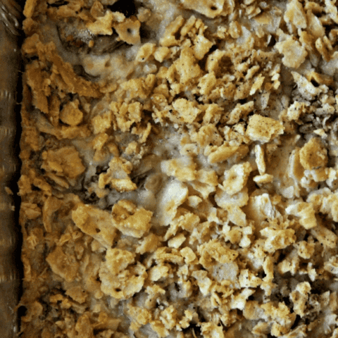 Homemade baked oatmeal in a foil tray, showcasing a golden-brown, comforting texture.