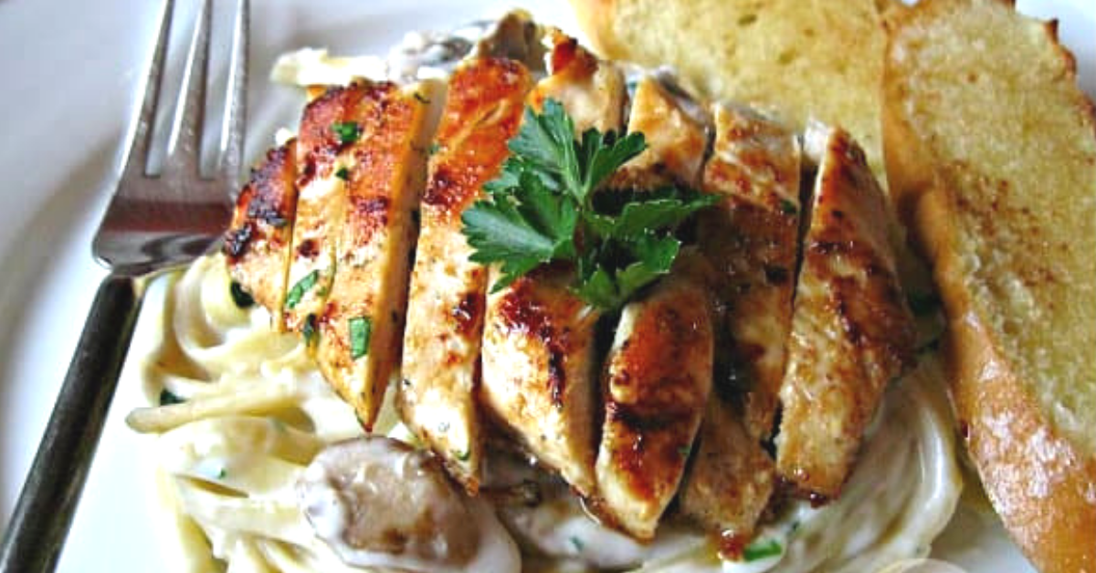 This simple chicken mushroom fettuccine alfredo is topped with a perfectly seasoned and seared chicken breast.