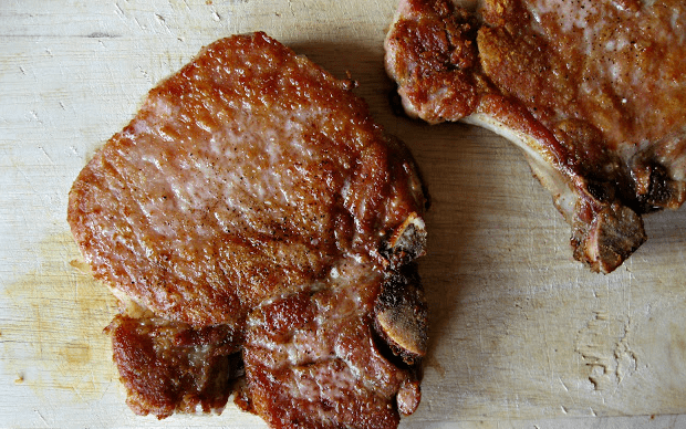 Juicy skillet fried thick-cut pork chops are a favorite in our house. Easy for a busy weeknight, and fall-off-the-bone tender!
