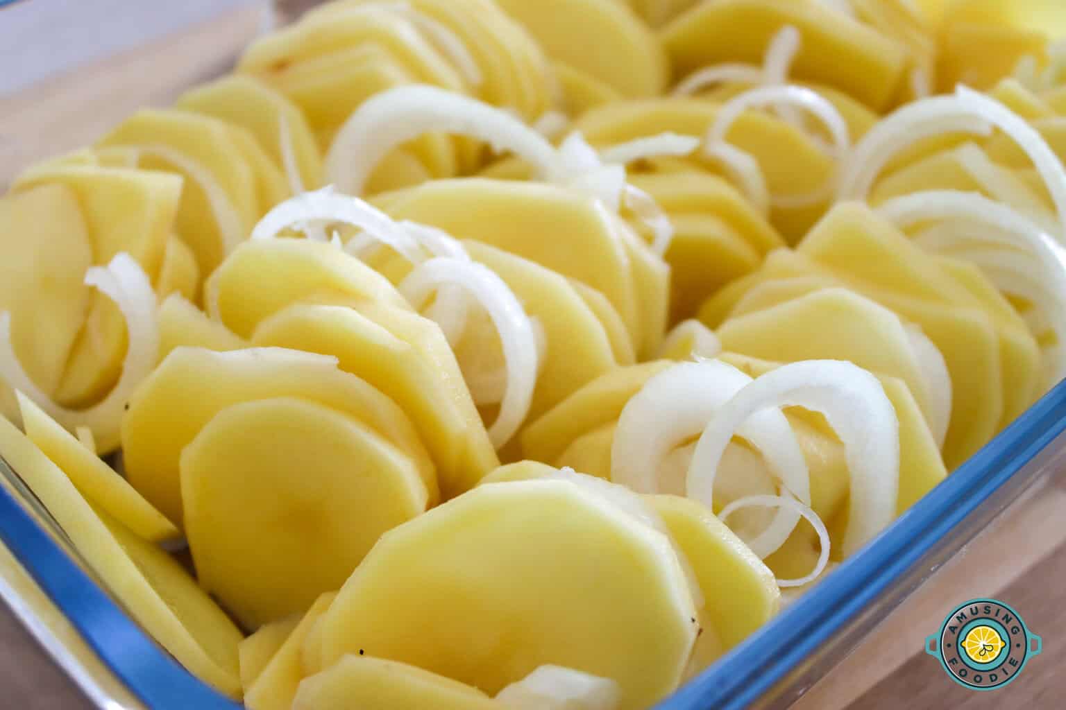 Sliced potatoes and onions closeup