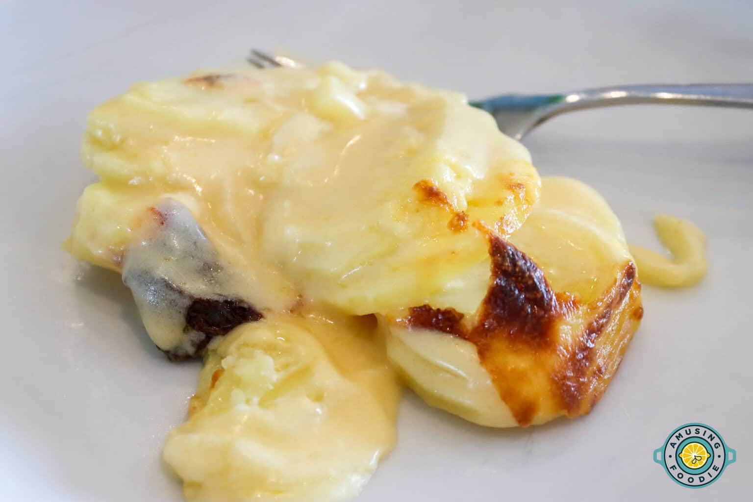 creamy scalloped potatoes on plate 1