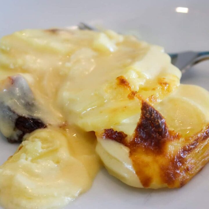 creamy scalloped potatoes on plate