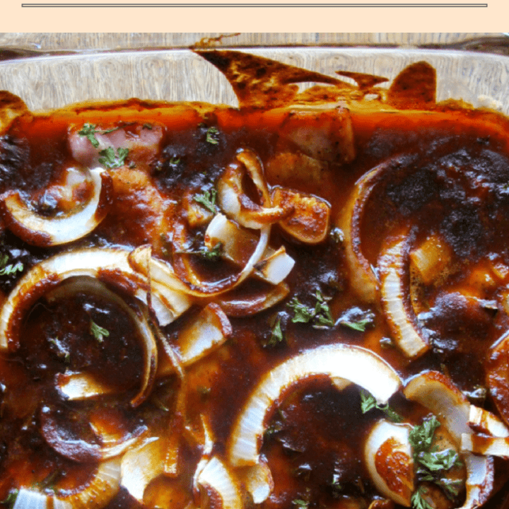 Delicious baked BBQ pork chops topped with onions and fresh herbs for a comforting meal.