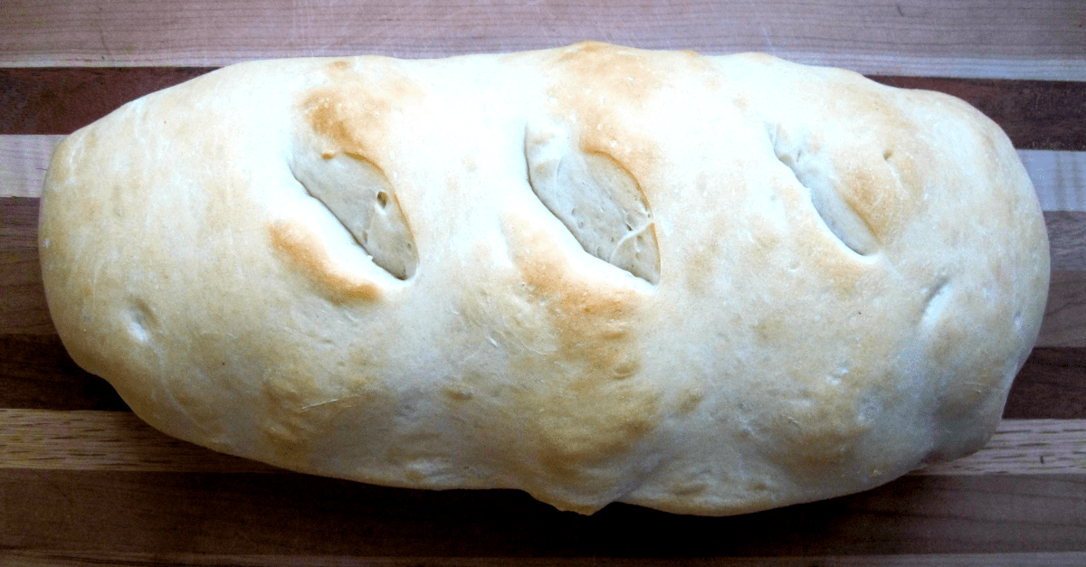 Freshly baked artisan rustic bread loaf with a golden crust, perfect for any meal.