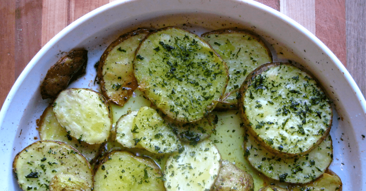 Herb-seasoned crispy sliced potatoes, beautifully arranged for a delightful side dish experience.