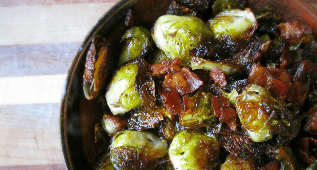 Crispy roasted Brussels sprouts with smoky bacon for a delicious comfort food experience.