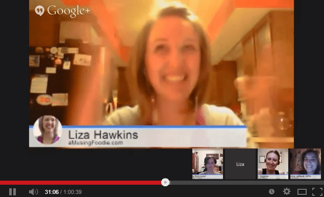 Screenshot of a live video with a woman on full screen and four other women in thumbnails at the bottom. There is a white banner across the bottom third that says, "Liza Hawkins; aMusingFoodie.com."
