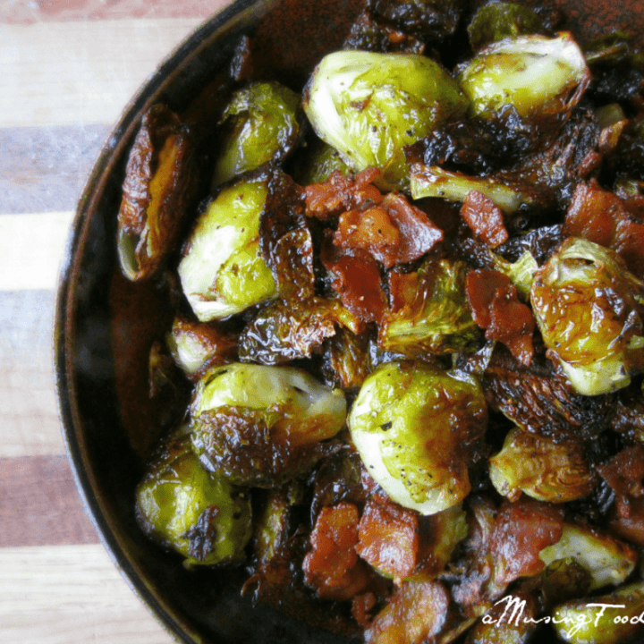Delicious roasted Brussels sprouts with crispy bacon in a rustic bowl, perfect for comfort food.
