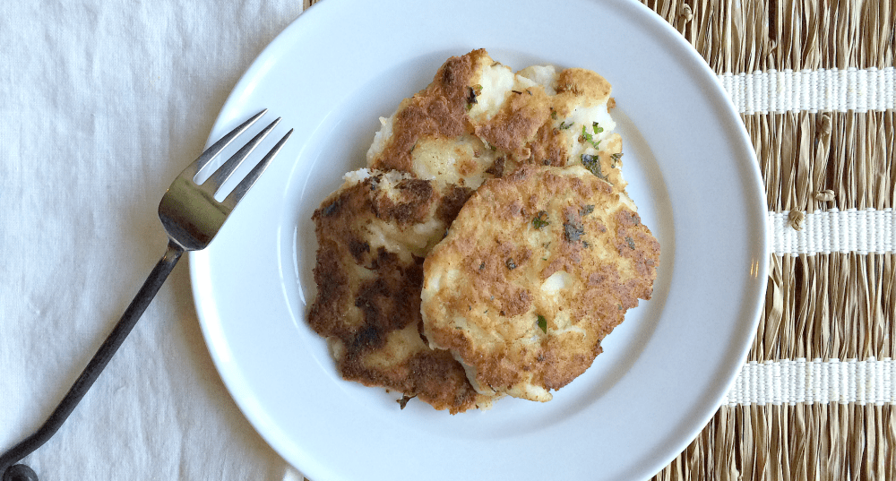 Delicious golden fritters served on a white plate, perfect for any homemade meal.