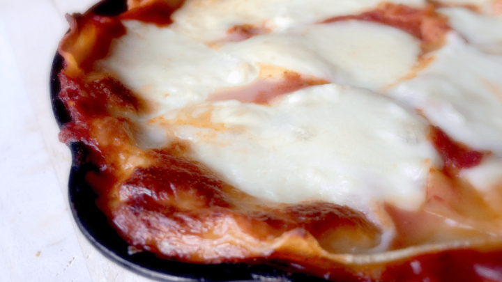 Cast Iron Skillet Lasagna - crispy around the edges and fully of ooey-gooey mozzarella and provolone!