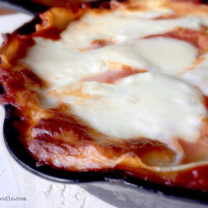 Cast Iron Skillet Lasagna - crispy around the edges and fully of ooey-gooey mozzarella and provolone!