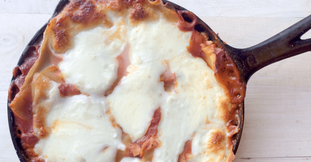 Cast Iron Skillet Lasagna is crispy around the edges and fully of ooey-gooey mozzarella and provolone!