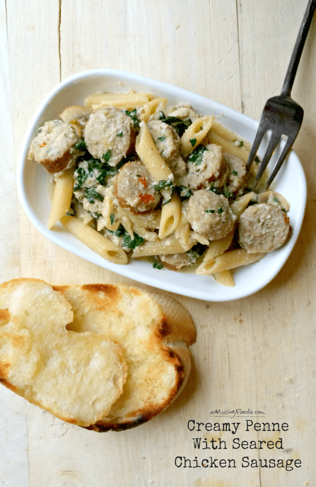 Creamy Penne With Seared Chicken Sausage: easy weeknight pasta dish full of mushrooms, spinach, onions and a savory creamy chicken sauce using ricotta!
