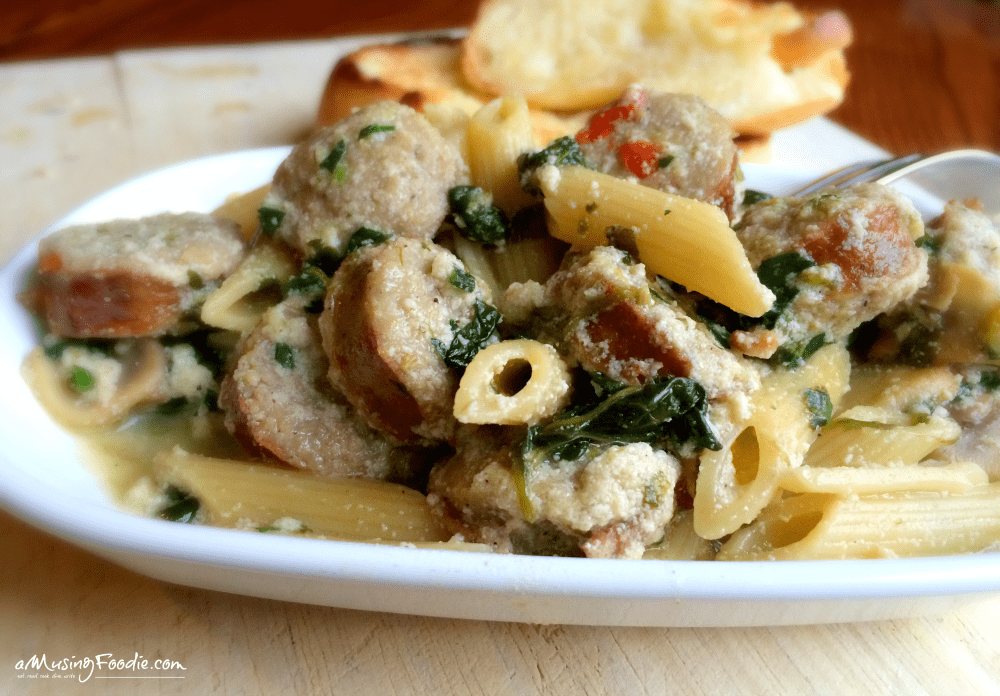 Creamy Penne With Seared Chicken Sausage: easy weeknight pasta dish full of mushrooms, spinach, onions and a savory creamy chicken sauce using ricotta!
