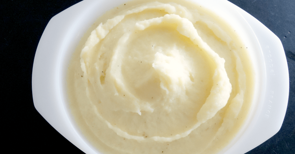 Creamy, velvety mashed potatoes in a rustic bowl, showcasing comfort food at its best.