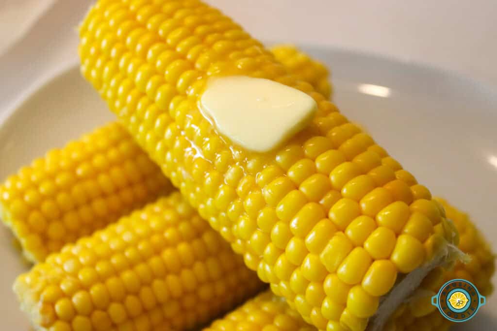 Corn cobs with butter closeup
