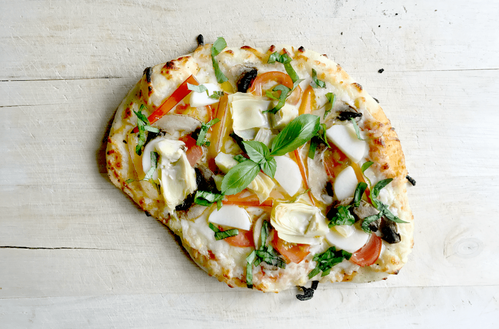This rustic homemade pizza, loaded with yummy veggies like hearts of palm, sweet peppers, tender small artichoke hearts, fresh tomatoes, is the perfect dinner for summer!