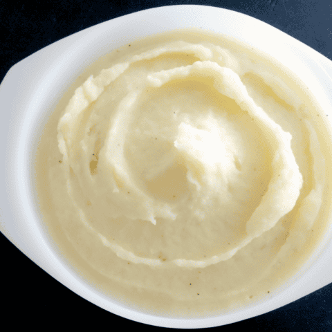 Delicious creamy mashed potatoes, the perfect comfort food for any holiday meal.