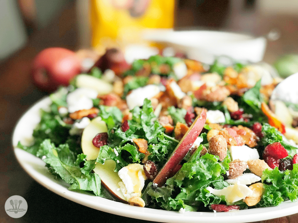 This winter kale salad is topped with Sahale Snacks Honey Almonds Glazed Mix, full of dried cranberries, sliced red pears, crispy bacon, honey goat cheese and a hint of lime juice. A simple homemade honey mustard dressing drizzled on top adds a final sweet and savory note. Yum!