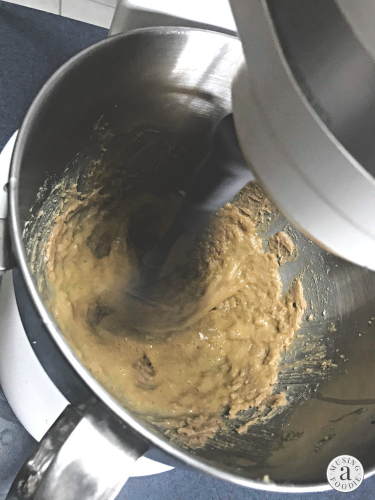 Cookie batter in a stand mixer.