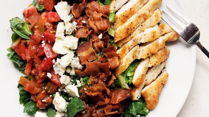 BLT salad with heirloom tomatoes, bleu cheese, bacon, romaine lettuce and crispy chicken and balsamic vinaigrette dressing.